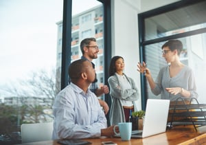 Four people engaging in conversation