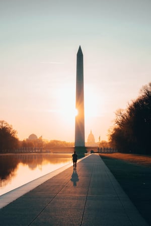 Decorative photo of Reflecting Pool and Washington Monument illuminated by a sunrise